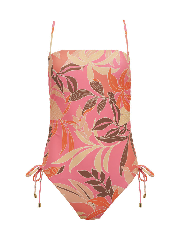 The Sanctuary Clothing banded shirr side one piece multi is a vibrant tropical floral swimsuit with thin straps and side ties at the hips.
