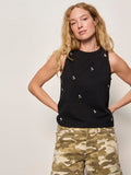 A woman with long blonde hair wears the Sanctuary Clothing campari embellished tank in black and beige camouflage pants, standing against a plain light background with her hands on her hips.