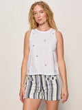 A woman with wavy blonde hair models the Sanctuary Clothing campari embellished tank in white, paired with high-waisted striped shorts in navy, beige, and white against a plain light background.