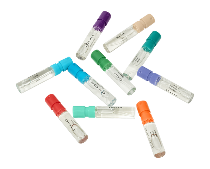 Multiple loose fragrance vials laying flat