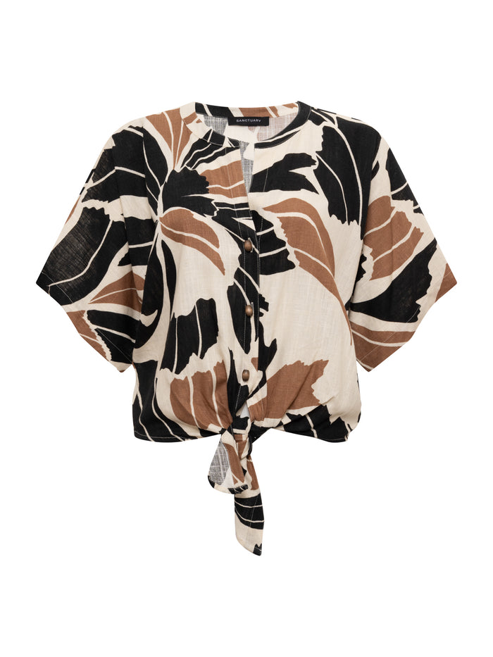 The good time tie shirt lotus in petite sizing by Sanctuary Clothing features short sleeves, a black and brown abstract floral print on white, front buttons, and a front waist tie knot.