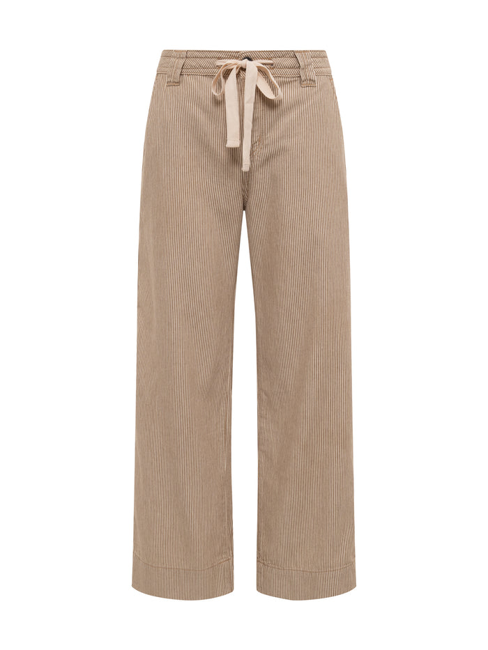 The Sanctuary Clothing lily stripe cropped pant in lido stripe features beige and white pinstripes, a drawstring waist, front pockets, and belt loops, shown on a plain white background. Available in extended sizing.