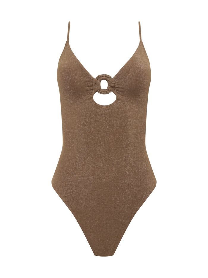 The Sanctuary Clothing ring front mio one piece in toasted coconut features thin straps, a deep V-neckline with a circular cutout and ring detail at the center, high-cut legs, and a subtly shimmery finish.