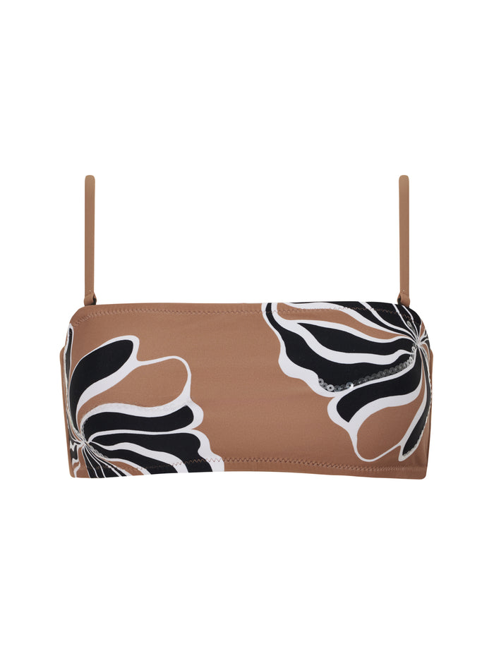 The sequin bandeau bikini top in toasted coconut by Sanctuary Clothing features thin shoulder straps and a bold black and white abstract floral print on one side.