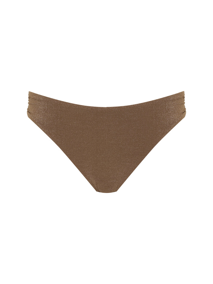 The Sanctuary Clothing side shirred hipster bikini bottom in toasted coconut features a sleek, shimmery brown design with subtle ruching on the sides, shown against a plain white background.