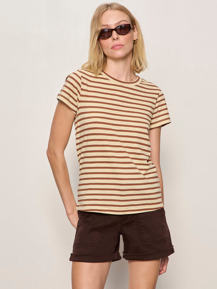 A woman with blonde hair and sunglasses, wearing the Sanctuary Clothing "the perfect tee choco banana stripe," stands against a plain light background.