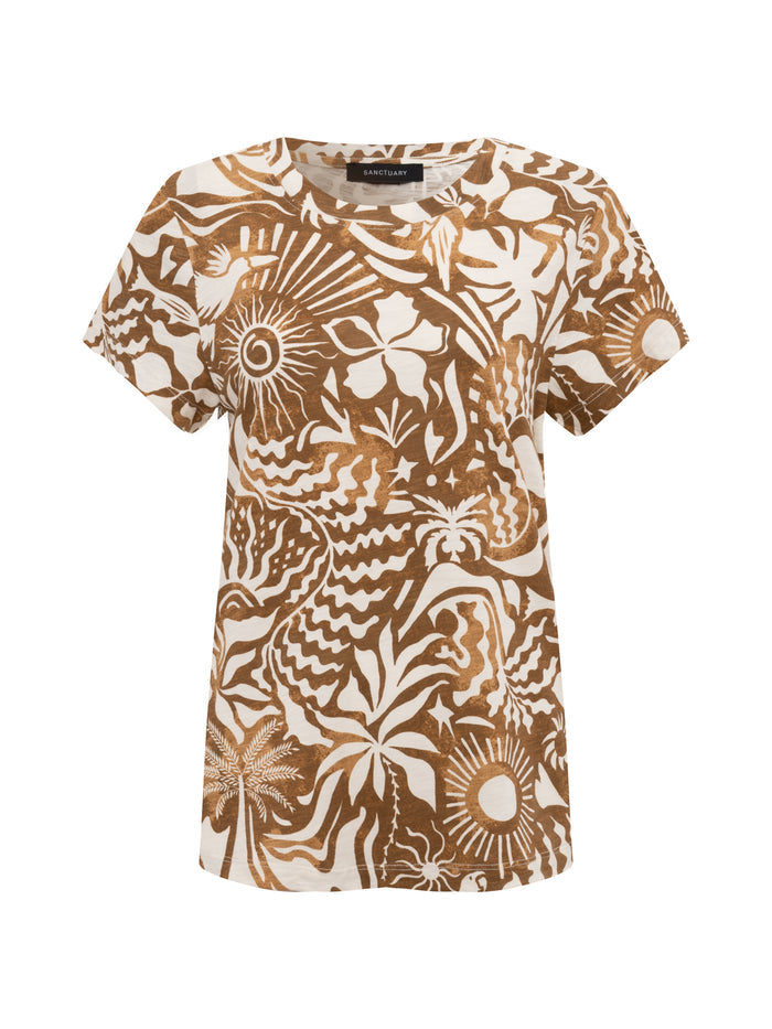 The perfect tee full moon by Sanctuary Clothing is a short-sleeve t-shirt with a brown and white tropical abstract pattern of leaves, suns, and geometric shapes. It features a round neckline and a relaxed fit.