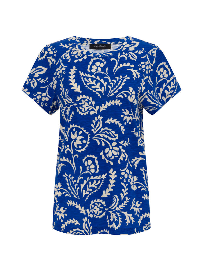 The perfect tee portofino by Sanctuary Clothing is a short-sleeved blue t-shirt with an allover white floral and leaf print, features a round neckline and casual fit.